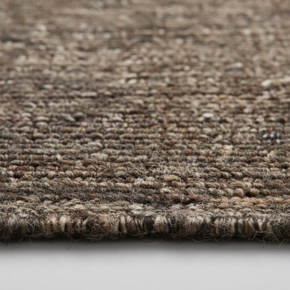 Handwoven chunk wool rug in neutral tones for cozy modern farmhouse and boho decor