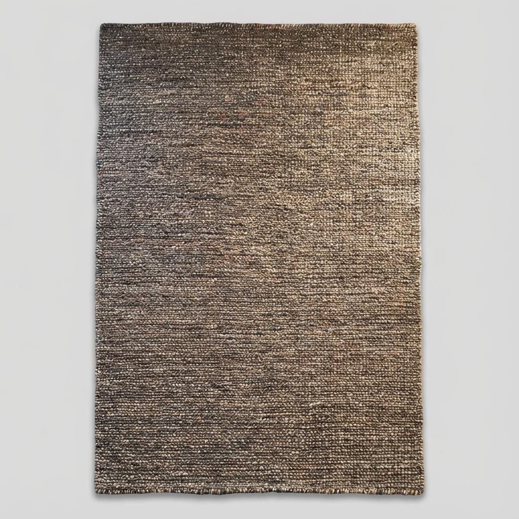 Handwoven natural wool area rug featuring chunky weave and earthy colors, ideal for cozy boho or Scandinavian interior designs