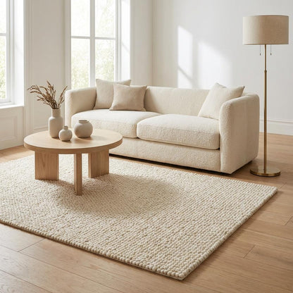 Chunky handwoven wool rug in neutral cream tone for Scandinavian and minimalist decor