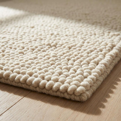 Chunky handwoven wool rug in neutral cream for Scandinavian and minimalist home decor
