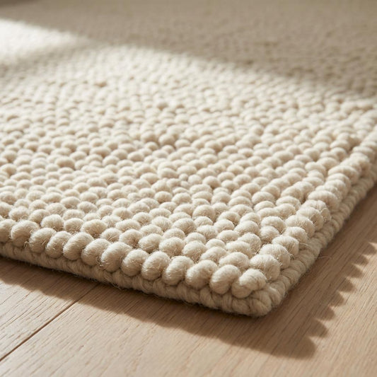 Chunky handwoven wool rug in neutral cream for Scandinavian and minimalist home decor