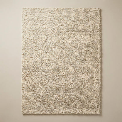 Chunky handwoven wool rug in neutral cream tone for Scandinavian minimalist decor