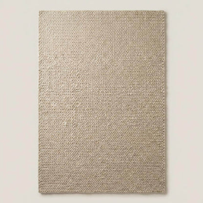 Chunky knit beige braided rug with thick textured wool-look and plush softness for cozy living room decor
