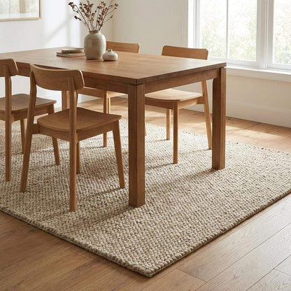 Chunky knit beige braided rug with thick textured wool-look and plush softness for cozy living room