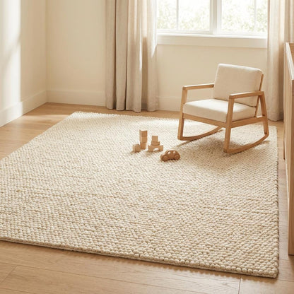 Chunky knit wool rug with thick looped cream texture, cozy and soft floor accent for neutral modern interiors
