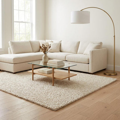 Handwoven chunky knit wool rug in soft ivory with thick loops for cozy modern living room decor
