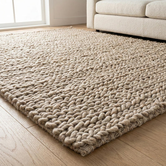 Chunky knit wool rug with thick oversized loops, plush texture, and neutral Scandinavian design for cozy home decor