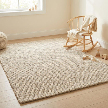 Chunky knit wool rug in neutral cream with thick plush texture for cozy living room décor