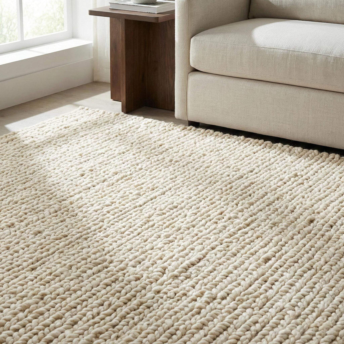 Thick neutral chunky knit wool rug with plush texture for cozy living room or nursery floors