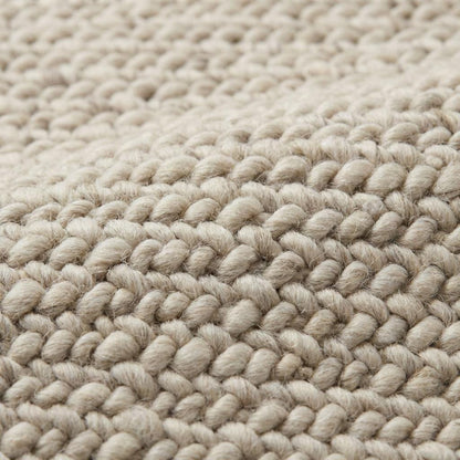 Chunky knit wool rug with thick neutral loops, soft textured luxury for modern cozy living room and bedroom decor