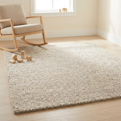 Chunky knit wool rug with thick, neutral wool loops and soft texture for cozy modern home décor