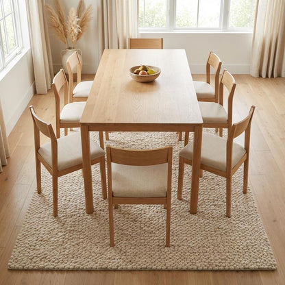 Handmade chunky knit wool rug with thick ivory loops, soft and cozy minimalist Scandinavian design.