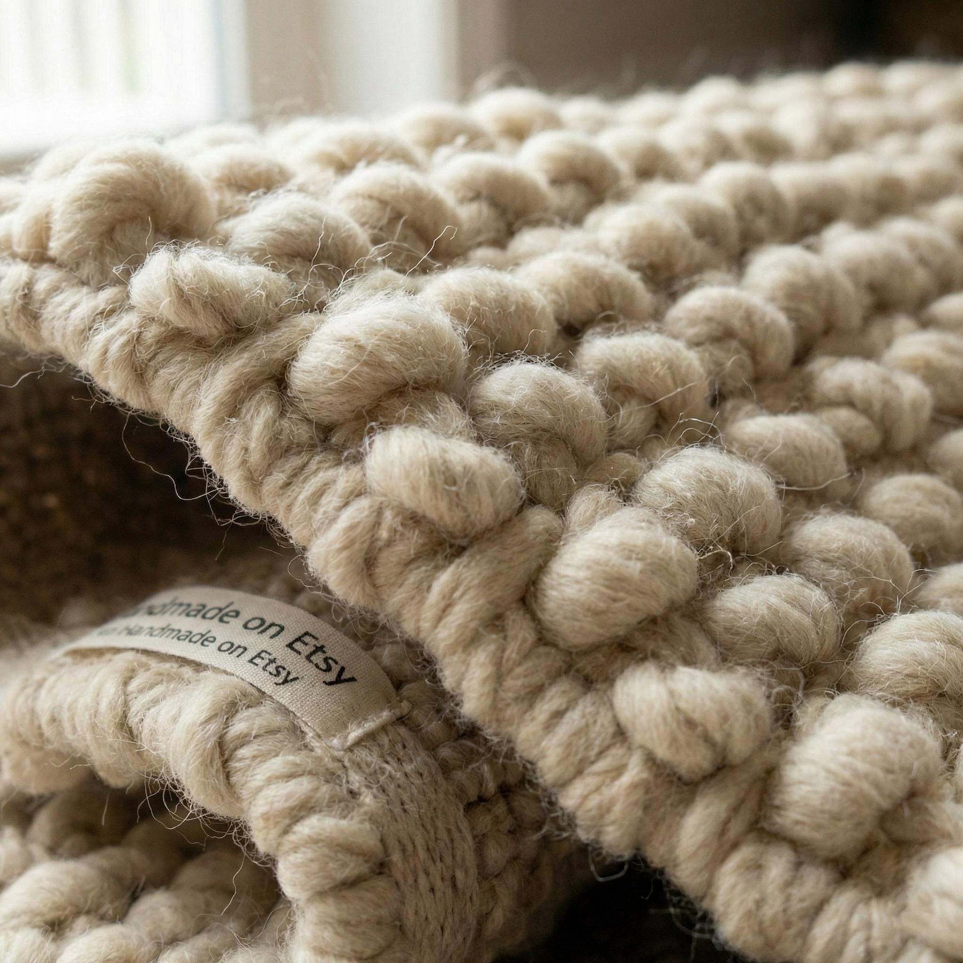 Chunky knit wool rug in cream beige with thick handmade texture for cozy home decor