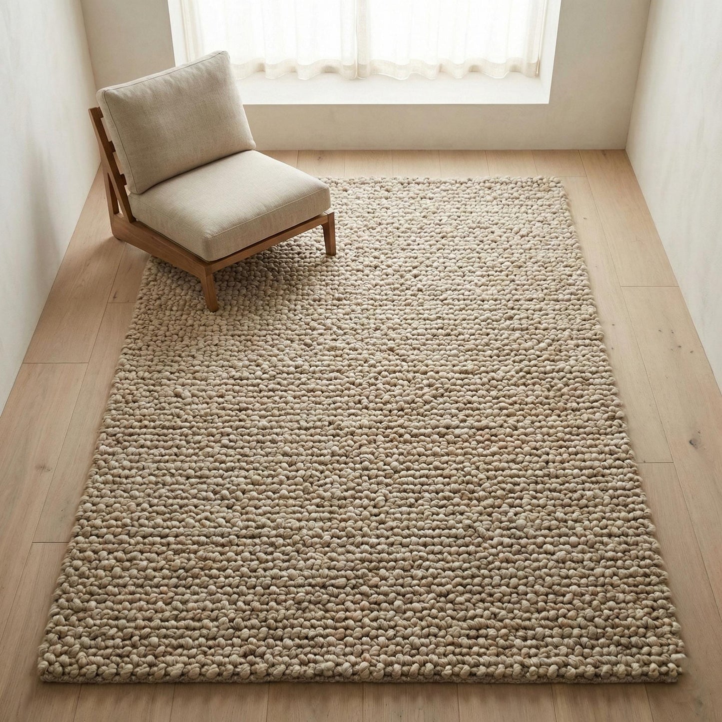Chunky loop textured area rug in neutral beige with thick, oversized pebble-like loops for cozy modern organic interiors