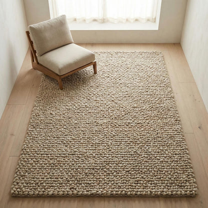 Chunky loop textured area rug in neutral beige with thick, oversized pebble-like loops for cozy modern organic interiors