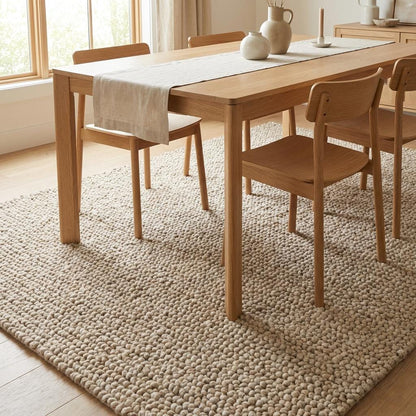 Chunky textured neutral rug placed in serene bedroom-style minimalist interior