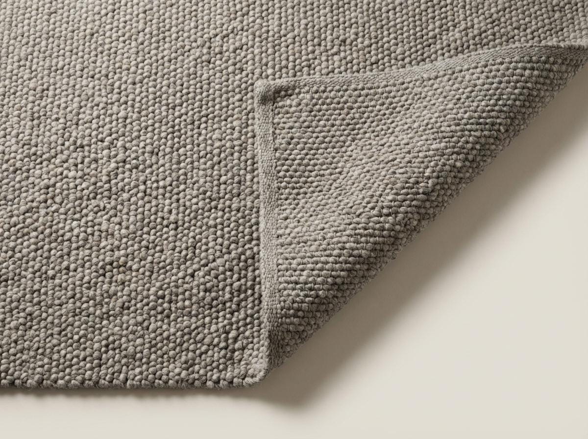 Chunky loop textured neutral area rug with thick yarn in cozy Scandinavian style