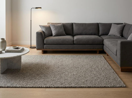 Chunky loop textured neutral area rug with thick yarn and cozy Scandinavian style for minimalist living room