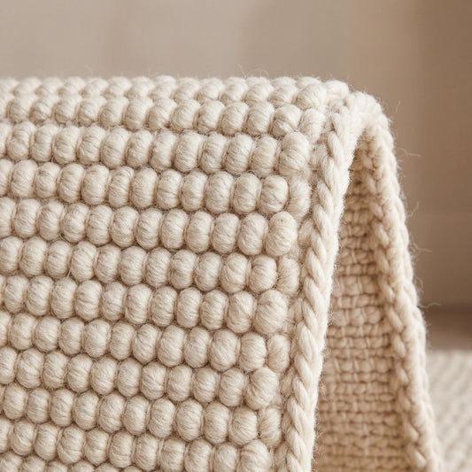 Cream chunky loop textured rug with thick handwoven cozy minimalist design