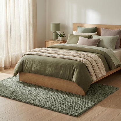 Chunky loop textured sage green rug with thick cozy minimalist organic design