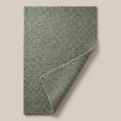 Chunky loop textured sage green rug with thick cozy organic loops for minimalist interiors