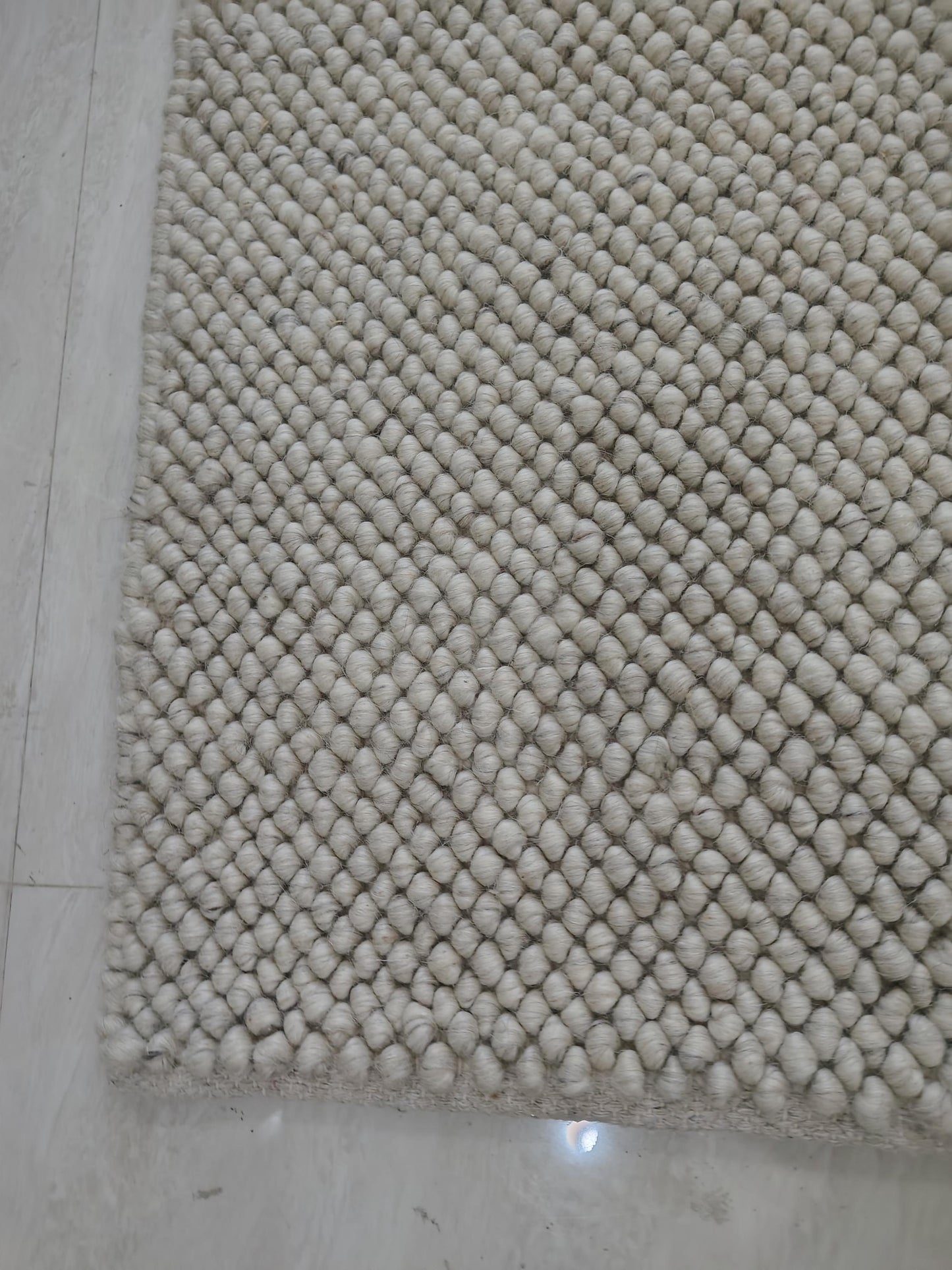 Plush textured cream rug styled for cozy Scandinavian interior