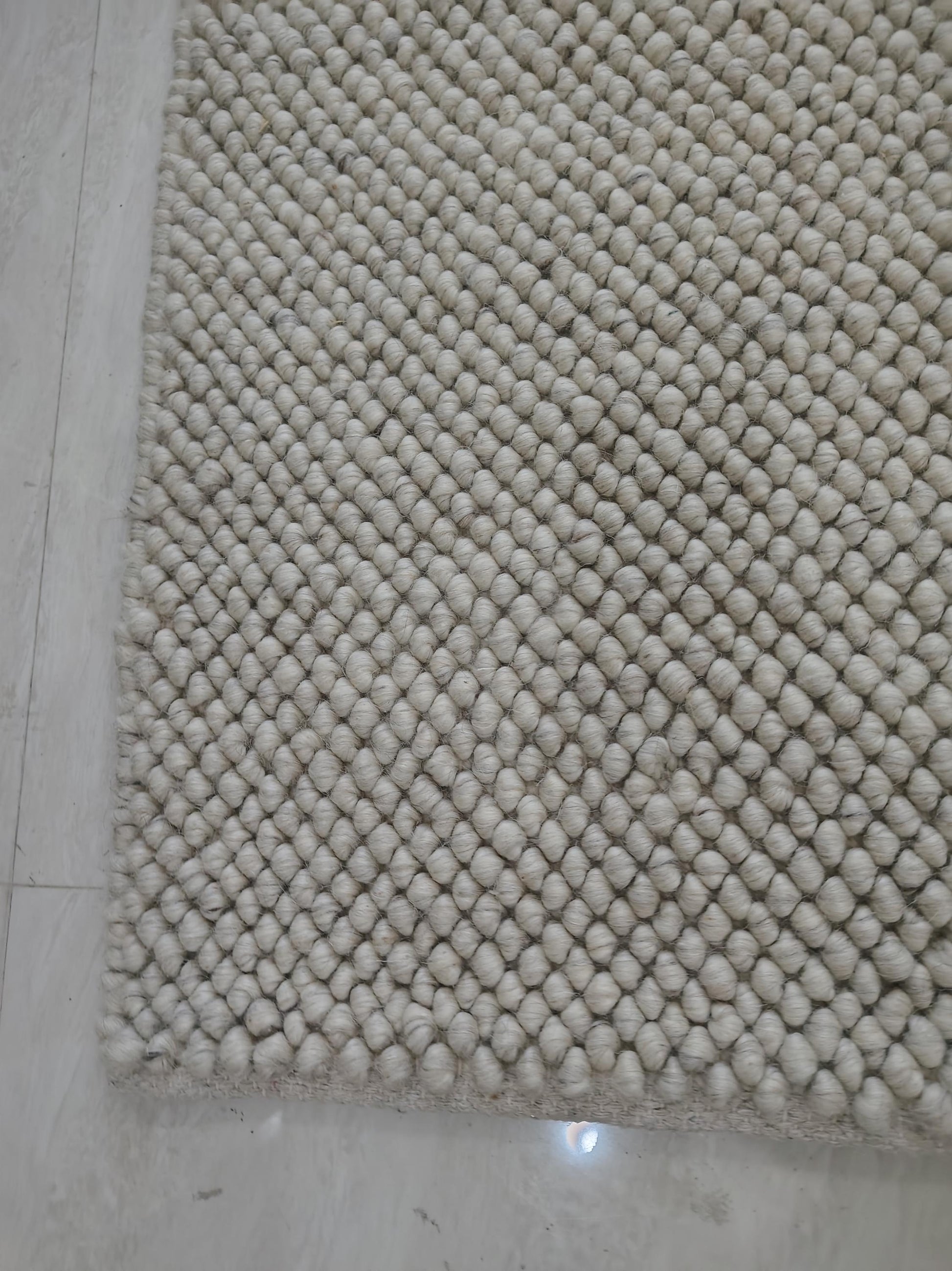 Plush textured cream rug styled for cozy Scandinavian interior