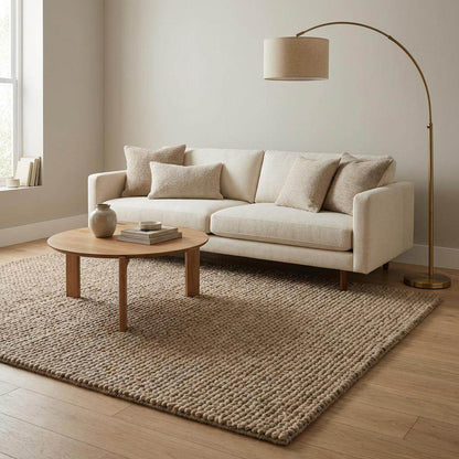 Chunky wool area rug with thick braided beige texture in cozy modern living room