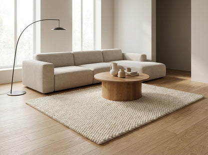 Chunky wool ivory area rug with thick textured Scandinavian design in neutral living room setting