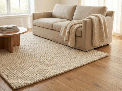 Chunky wool ivory area rug with thick, textured oversized loops and plush Scandinavian design