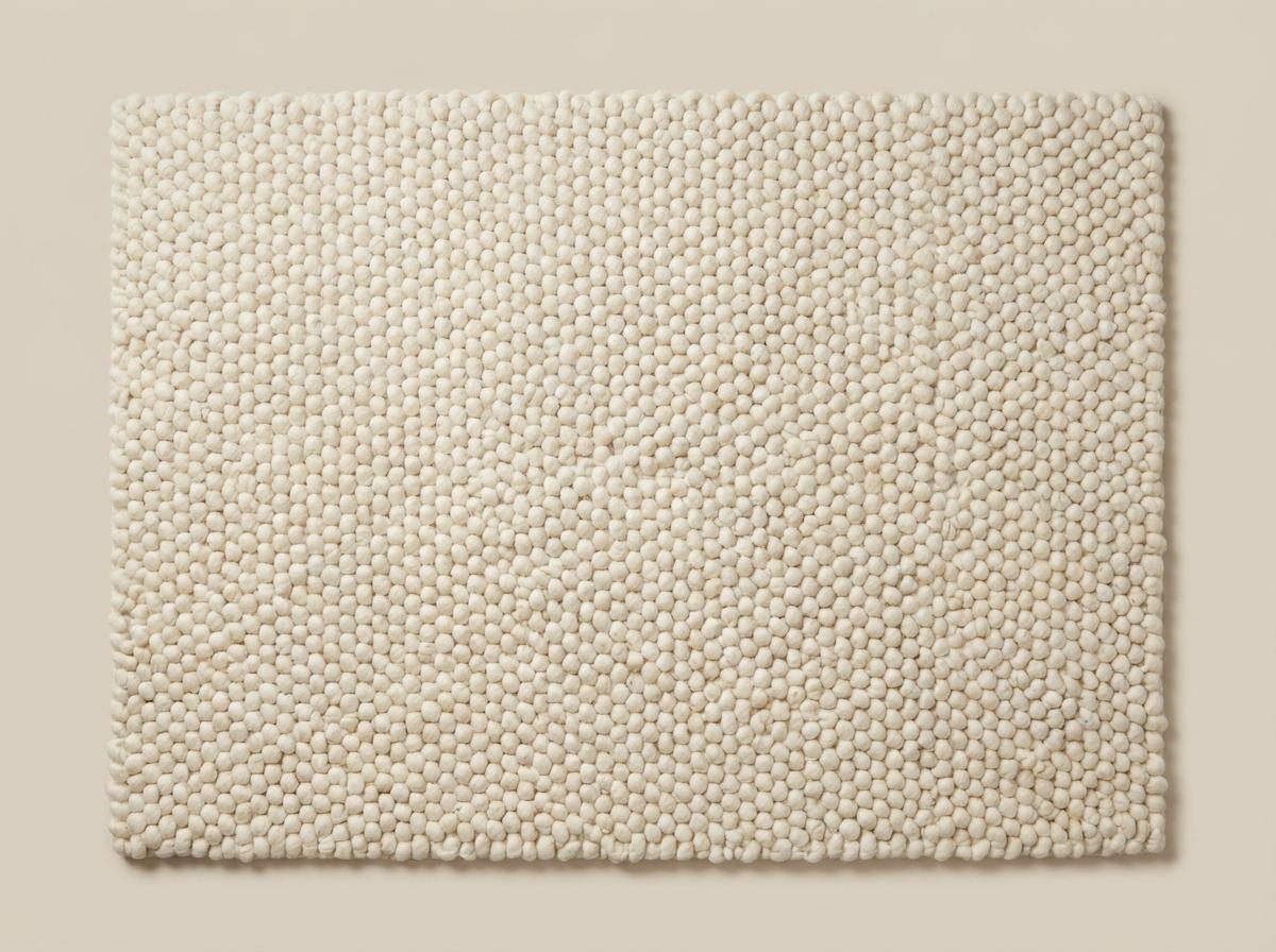 Chunky wool ivory area rug with thick textured loops and Scandinavian neutral design