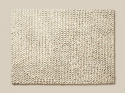 Chunky wool ivory area rug with thick textured loops and Scandinavian neutral design