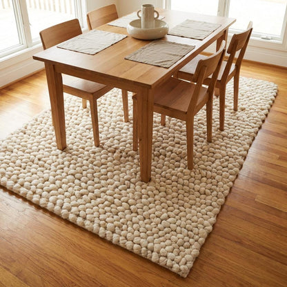 Chunky wool loop rug in cream with thick, textured yarn loops for a cozy, modern organic look