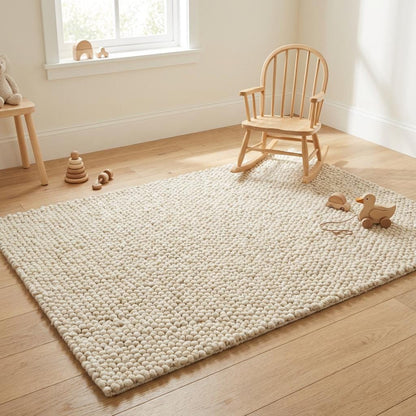 Chunky wool loop rug in cream with oversized loops and plush texture for cozy neutral decor