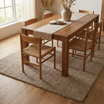 Handwoven chunky wool loop rug in neutral beige with thick textured weave, ideal for minimalist Scandinavian home decor