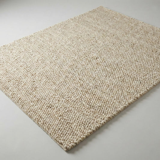 Chunky wool neutral area rug with thick textured cream loops for cozy modern interiors