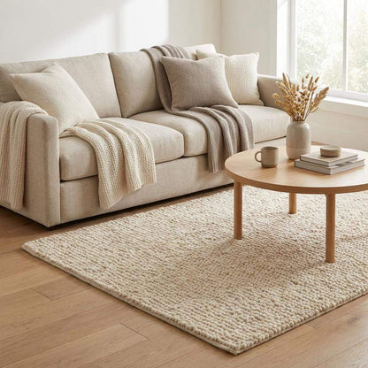 Chunky wool pebble rug in thick ivory with textured, looped wool clusters for cozy modern living room softness