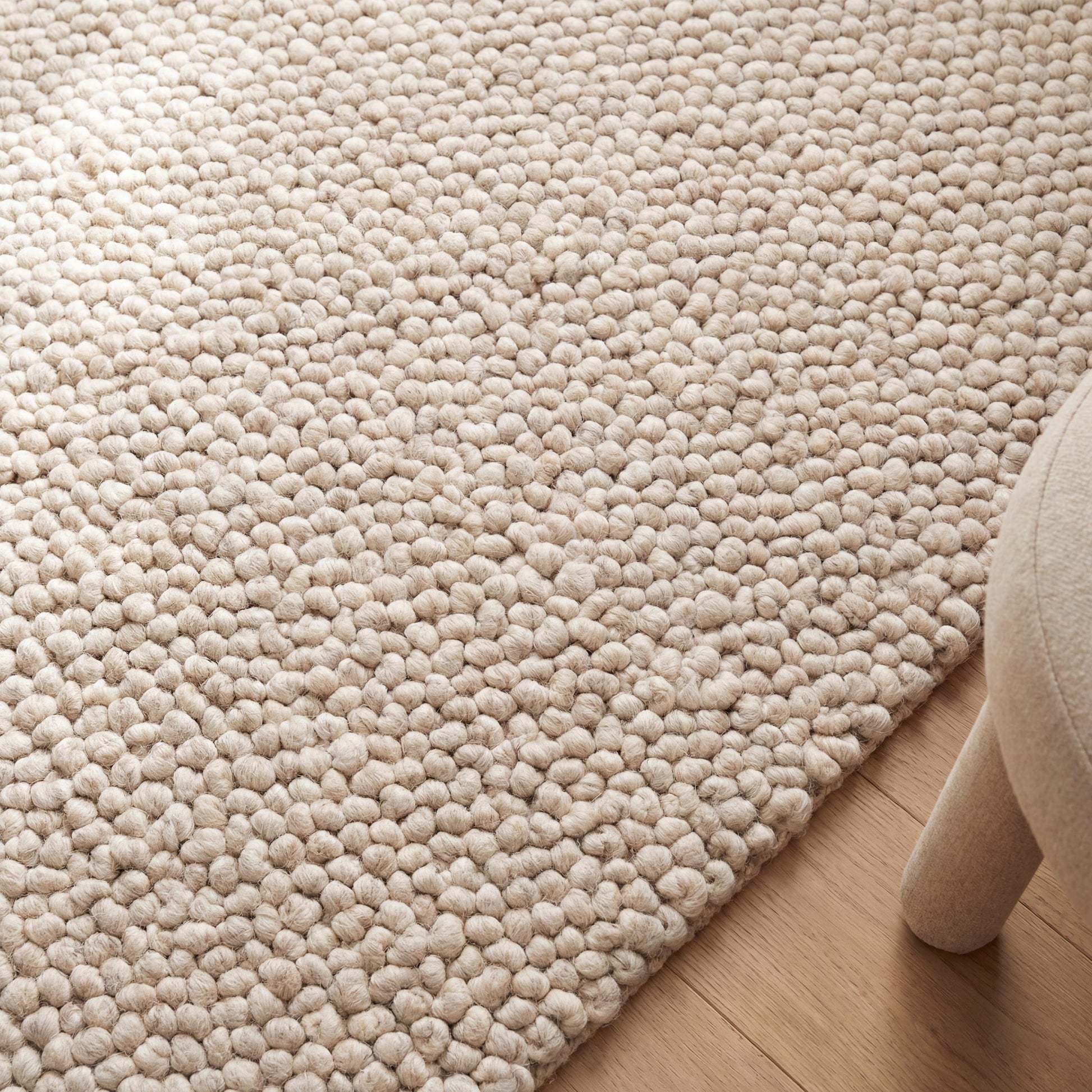 Handmade chunky wool rug in cream with thick loop pile, soft textured neutral boho area rug for cozy floors