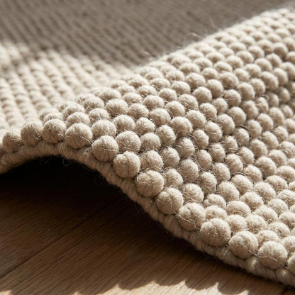 Handmade chunky wool rug with thick loop pile in cream, cozy and textured floor carpet for neutral boho decor