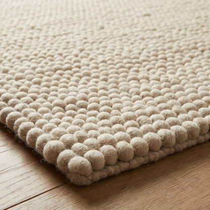 Chunky wool rug handwoven cream thick textured neutral Scandinavian modern living room carpet