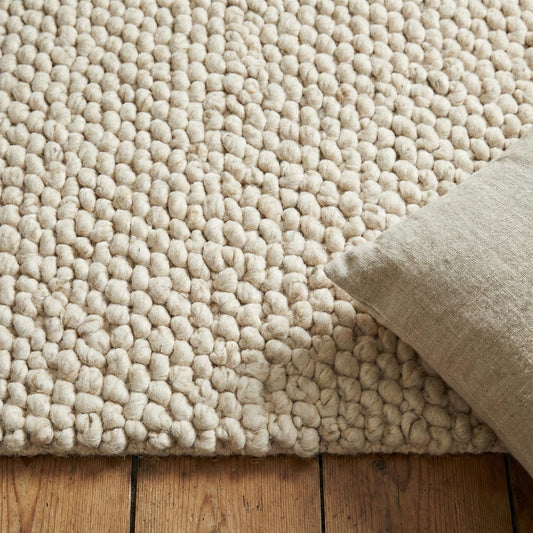 Chunky wool rug with thick looped cream texture for cozy modern farmhouse and Scandinavian decor