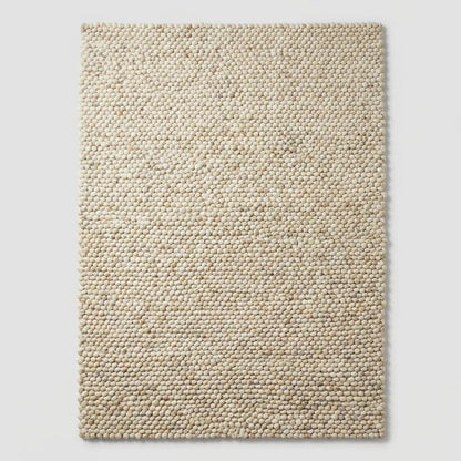 Thick wool area rug in cream neutral color, modern farmhouse living room floor rug