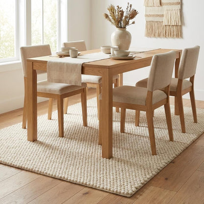 Chunky wool rug with neutral loop pile texture in minimalist living room decor