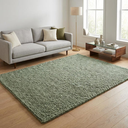 Chunky wool textured area rug in sage green with thick looped design and soft cushioned feel