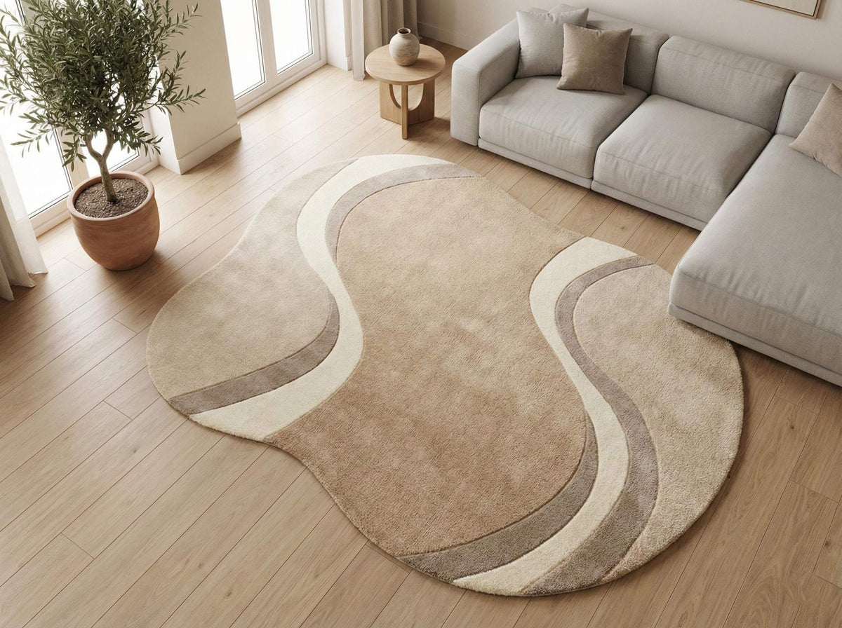 Modern curved rug living room with wavy abstract pattern in beige, cream, and taupe organic shape