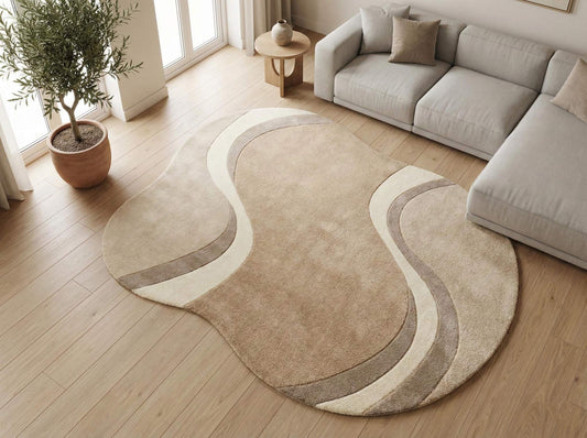 Modern curved rug living room with wavy abstract pattern in beige, cream, and taupe organic shape