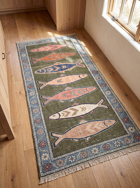 Hand knotted wool fish runner rug with olive green field and blue floral border displayed in a bright hallway with natural wood flooring. __etsy:8077245476