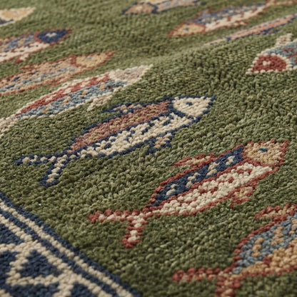 Close-up of hand knotted wool pile showing individual knots, natural fiber texture, and dense craftsmanship