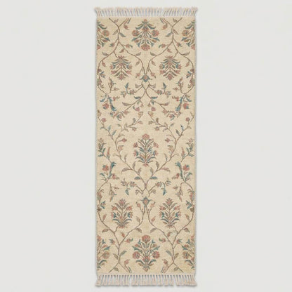 Ivory floral hand knotted runner rug with fringe edges