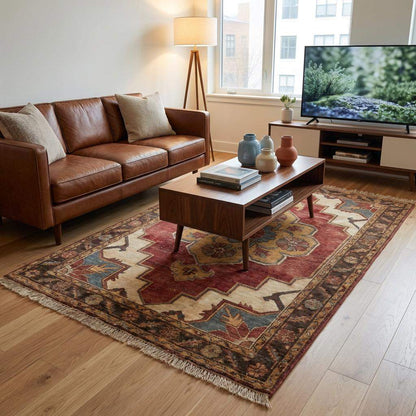 Hand knotted wool floral medallion Indo-Persian style area rug with brick red base and ivory golden accents